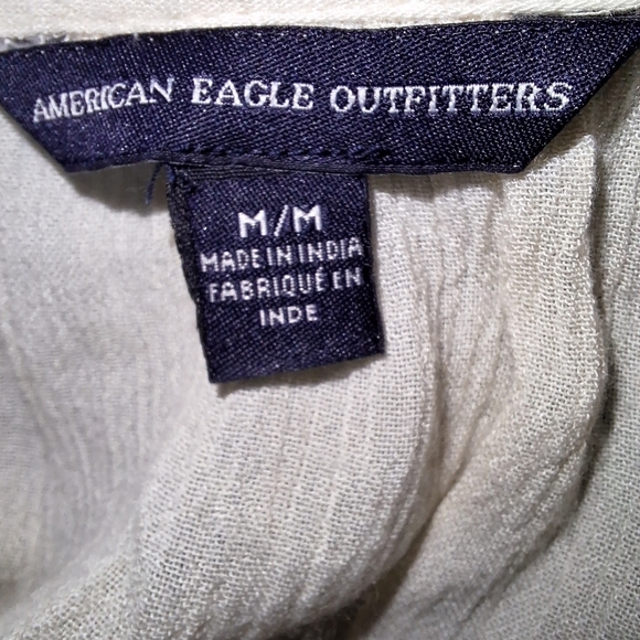 An American Eagle sheer and lace low-cut blouse in a size medium. - Picture 3 of 9